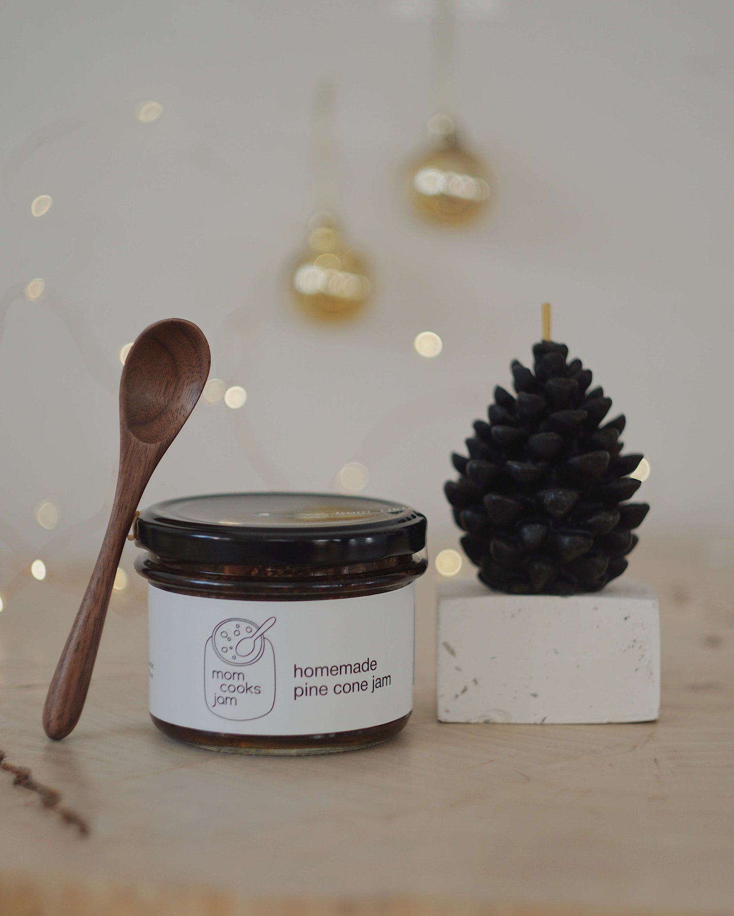 Pine cone jam gift set with a wax candle and wooden spoon from Ukraine